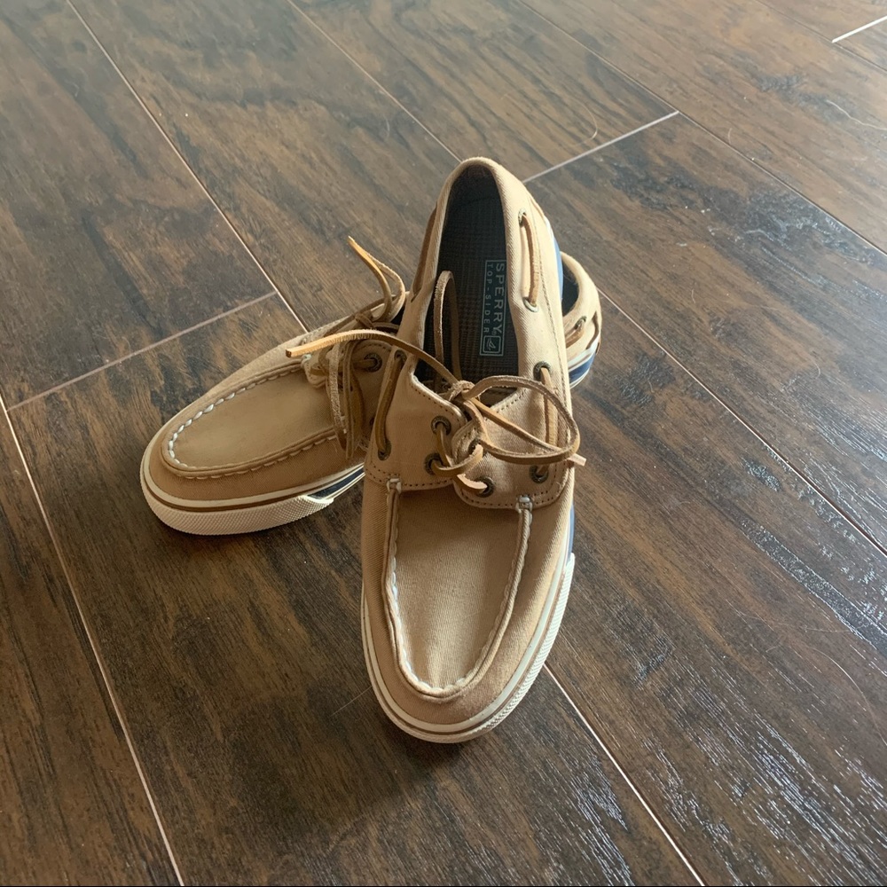 Dark tan sperrys with blue and red strips on sides